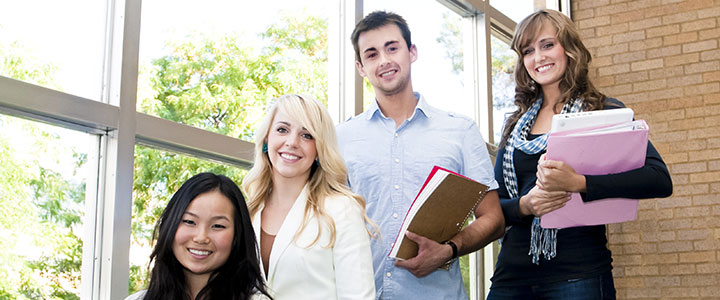 A college group is smiling