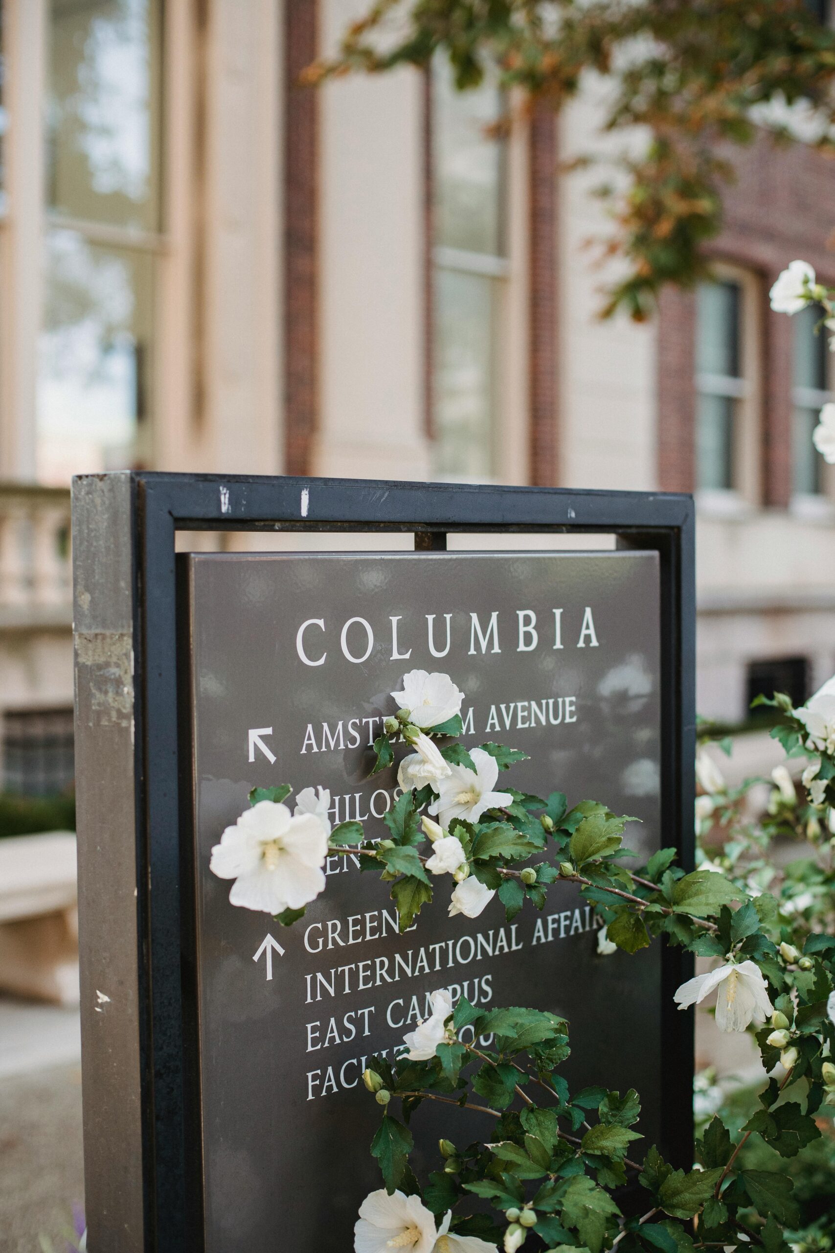 columbia university campus sign covered in flowers