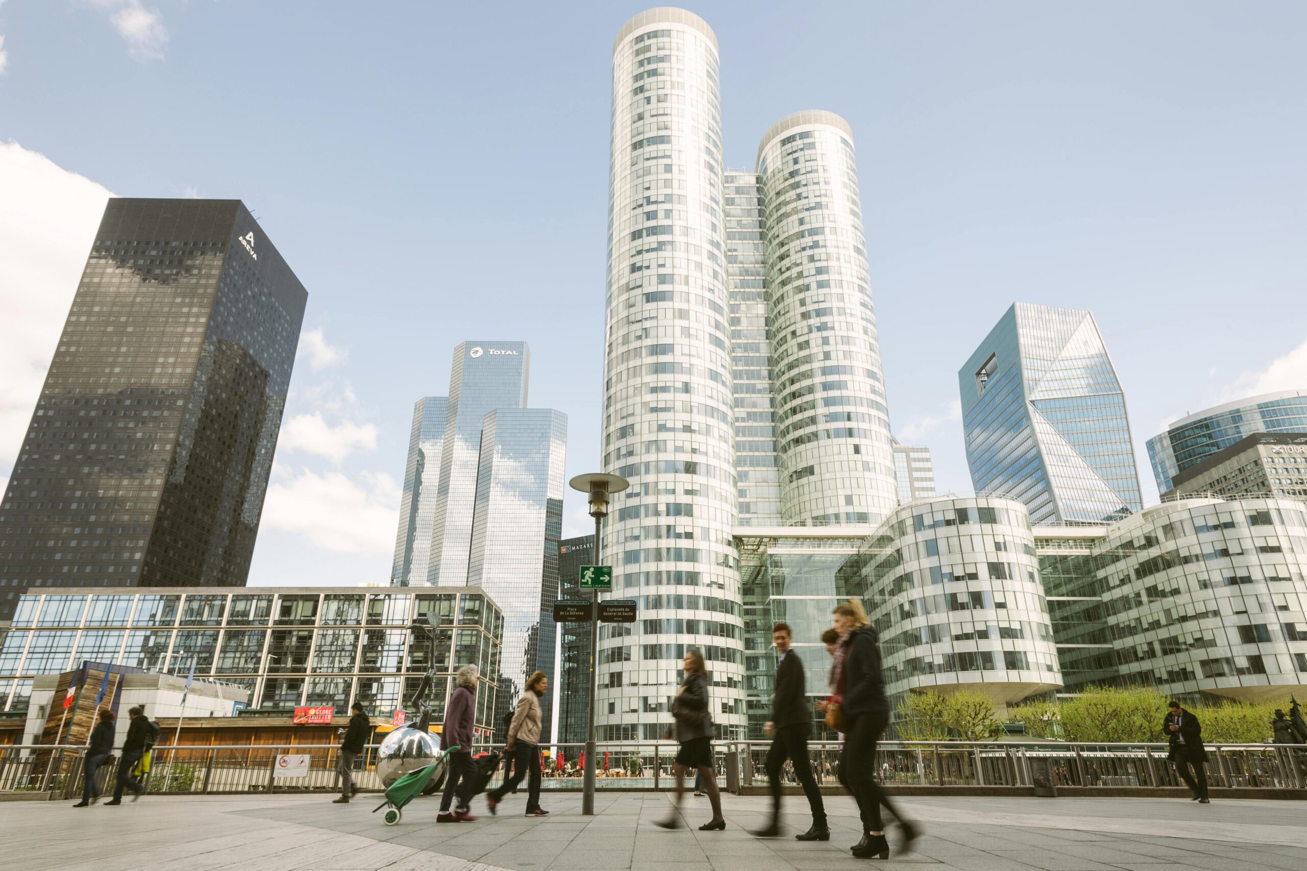 Business people walking through French city