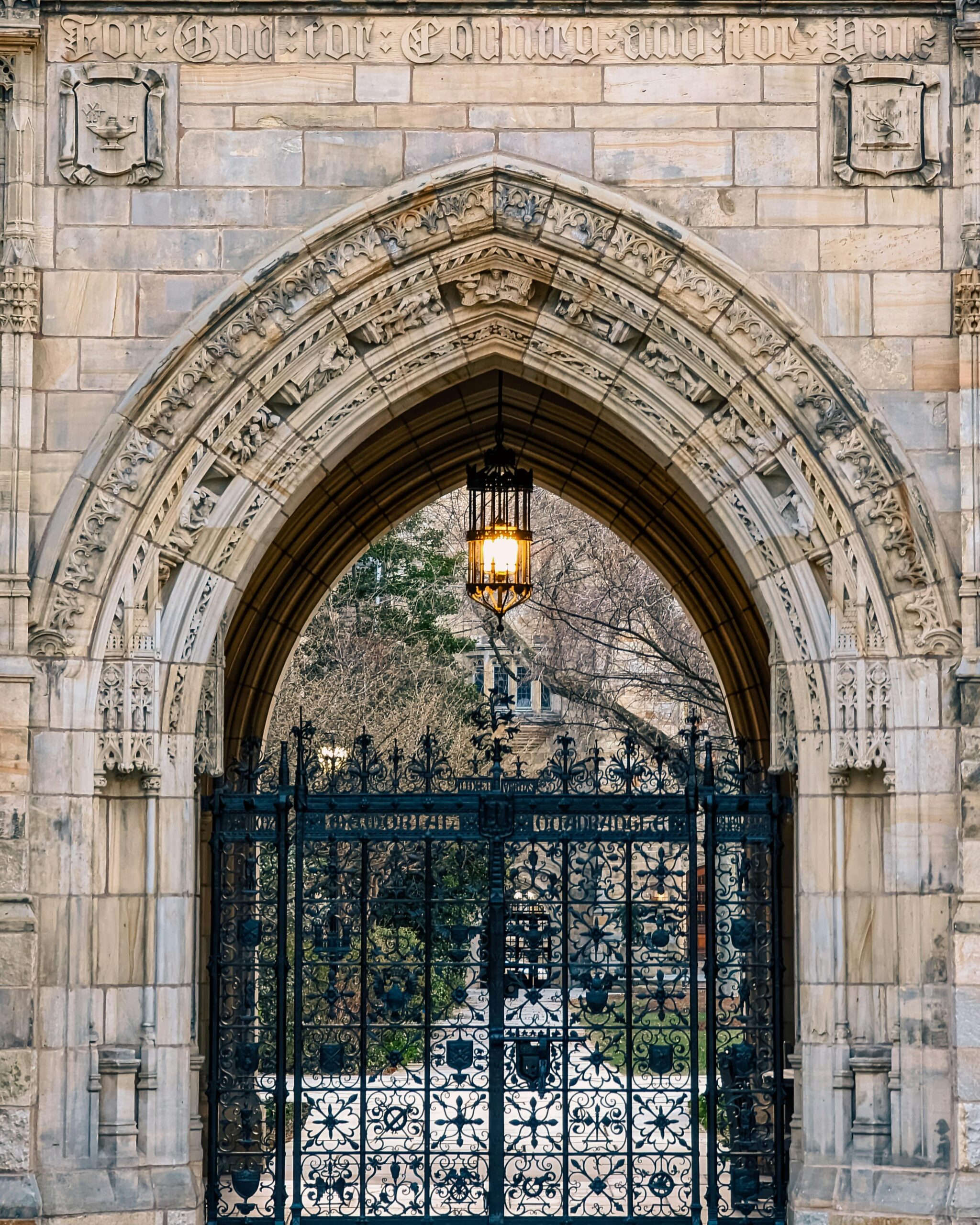 Stone arch with black metal gate at Yale University