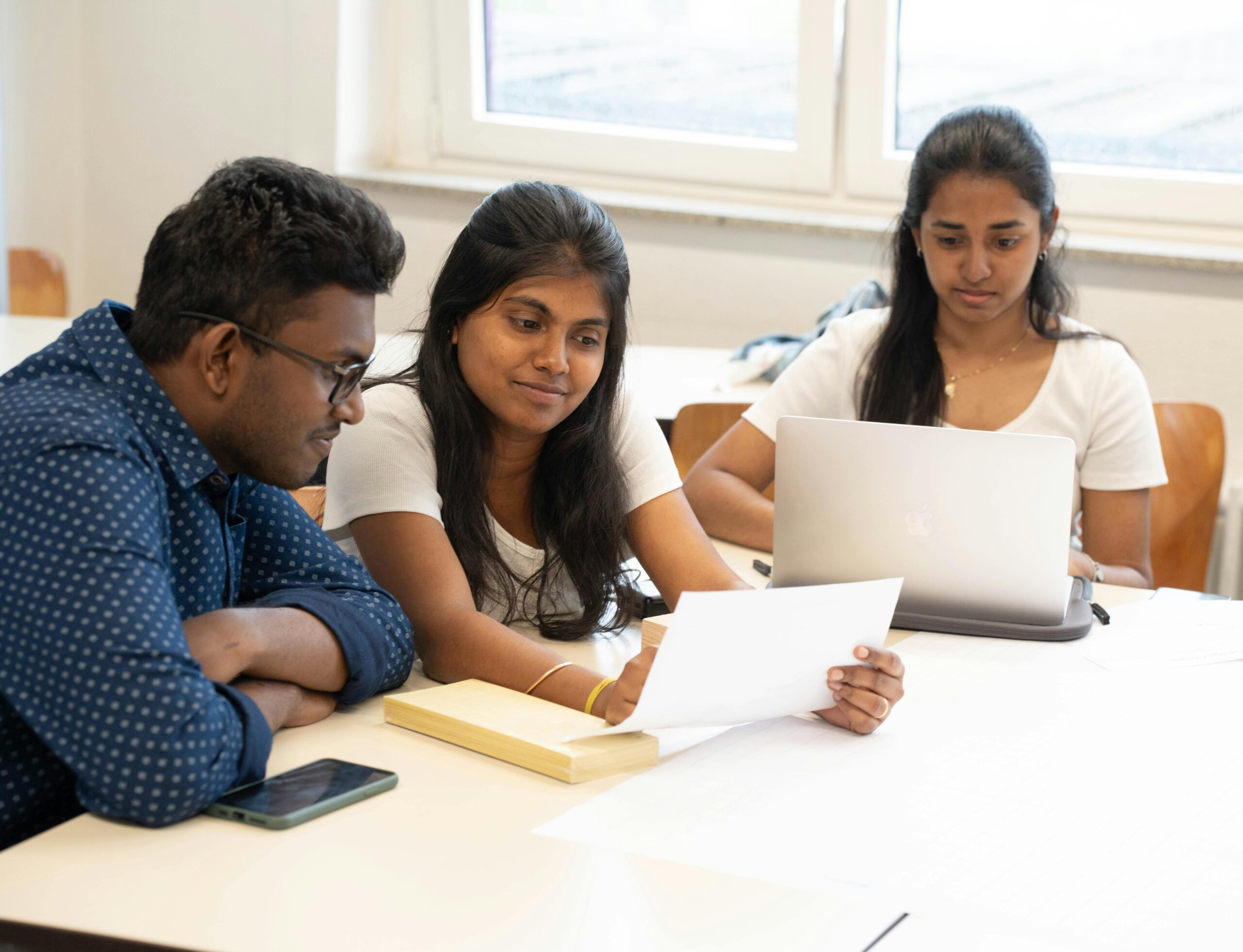 Diverse Group of Students Collaborating Inside