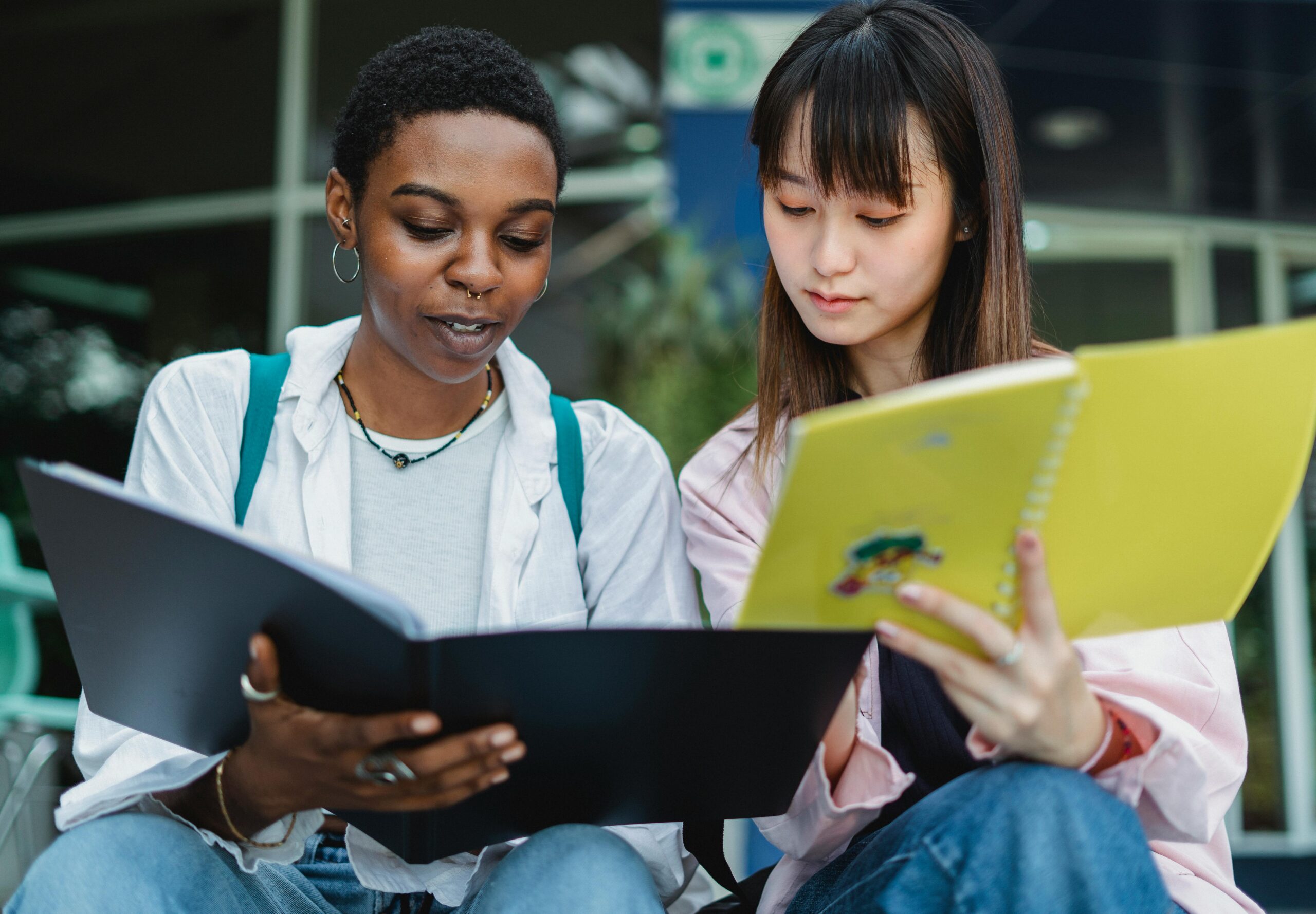 Students with exercise books doing homework
